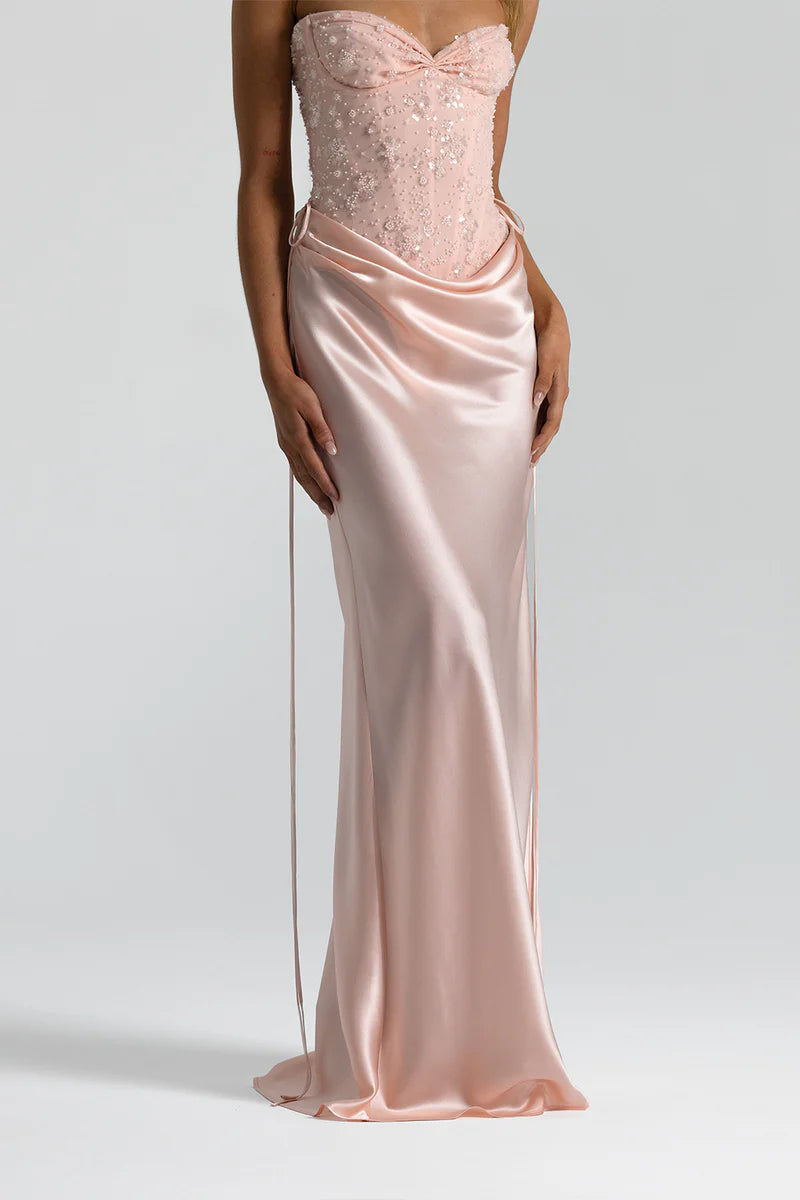 Baby pink Natalie Rolt set featuring the structured Verity Bustier and floor-length Evelyn Skirt.