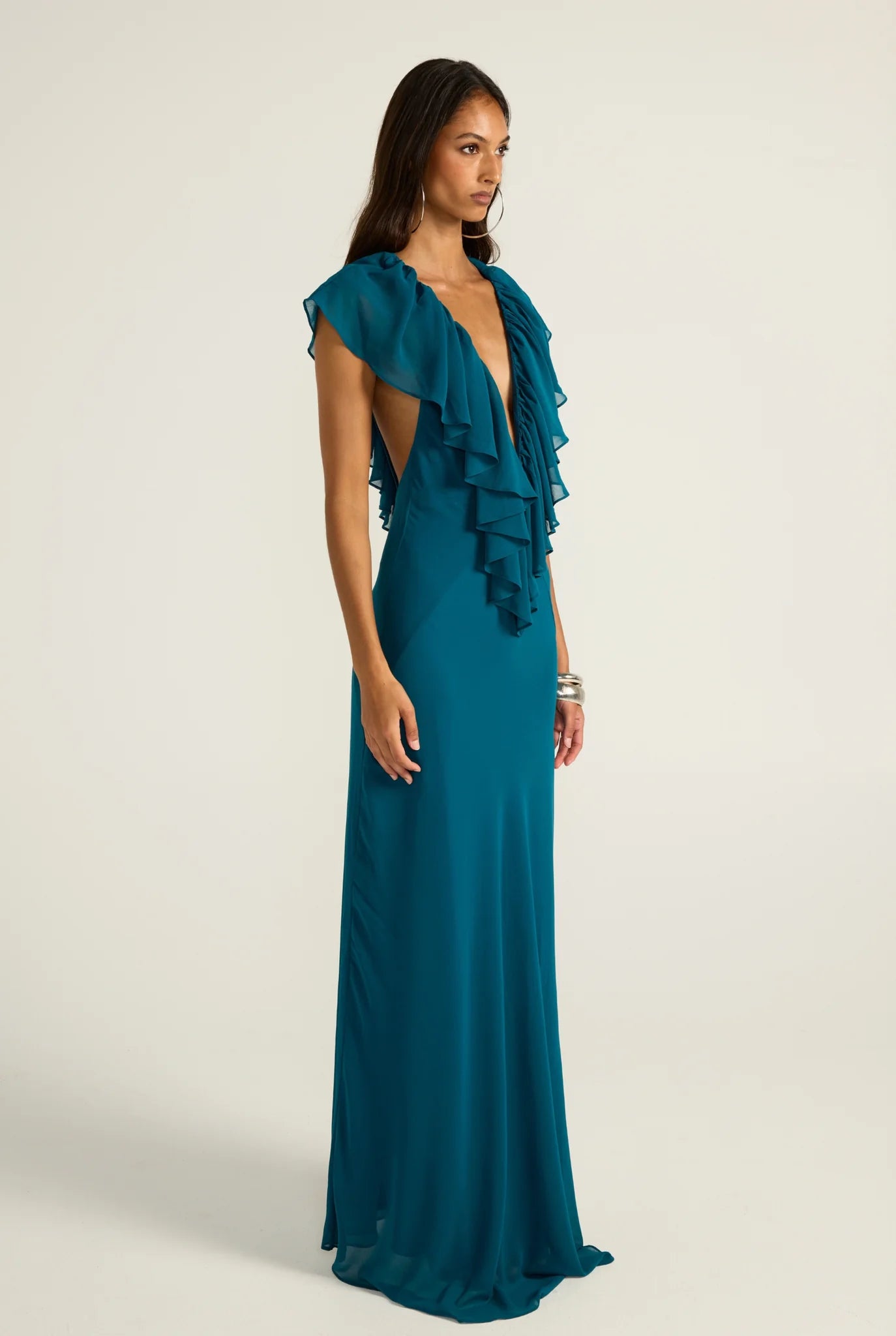Side front angle of Ance Gria Clover Gown in Teal. Enjoy Express Delivery & Simple Returns on all Sydney, Melbourne, Brisbane and Gold Coast Dress Hires. Book now to secure a rental period!