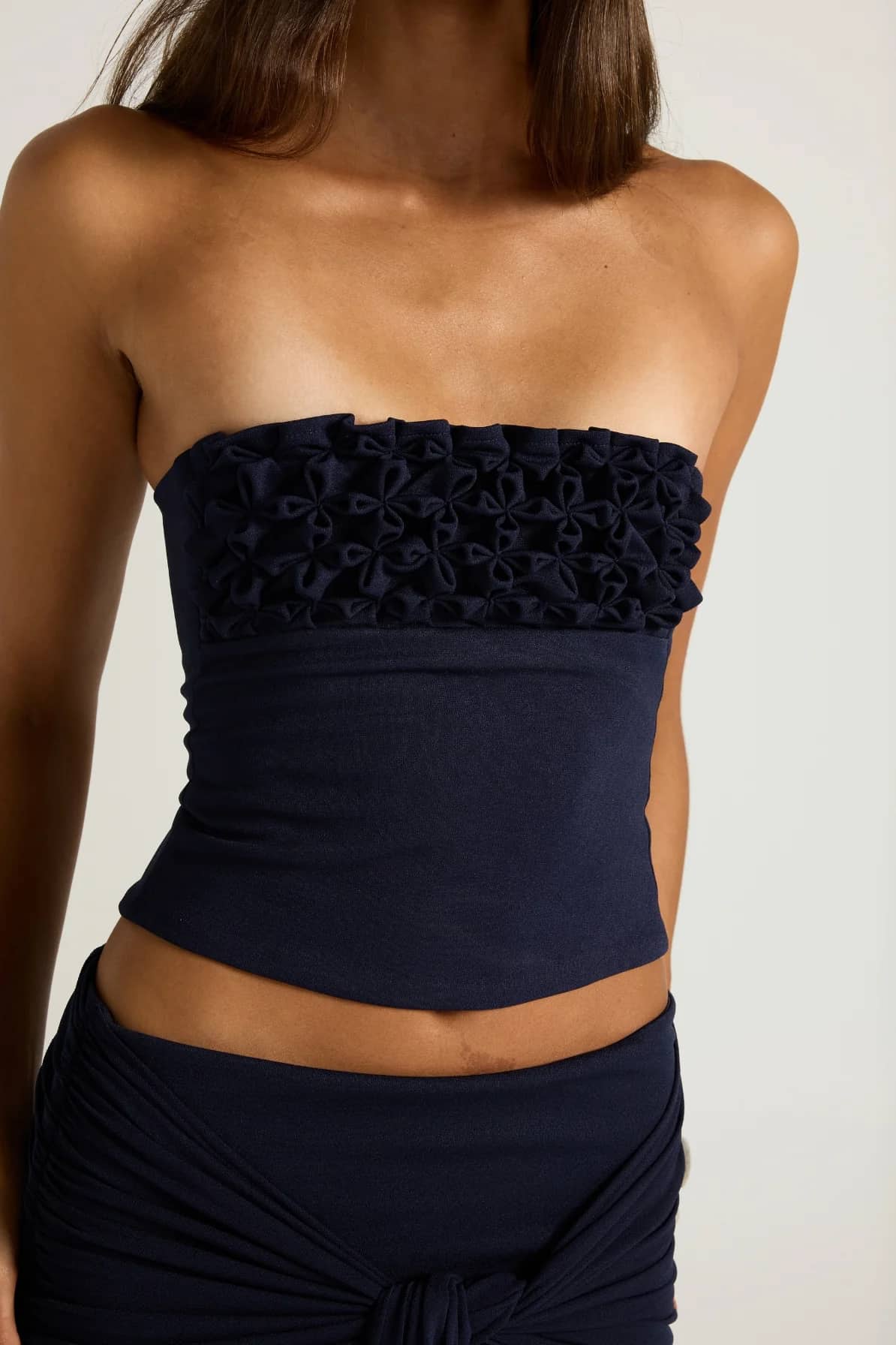Close up image of Ance Gria Jude Top in Navy. Hire the full set from Cc Dress Hire with local Perth collections or Australia-Wide Express Shipping. Book now!