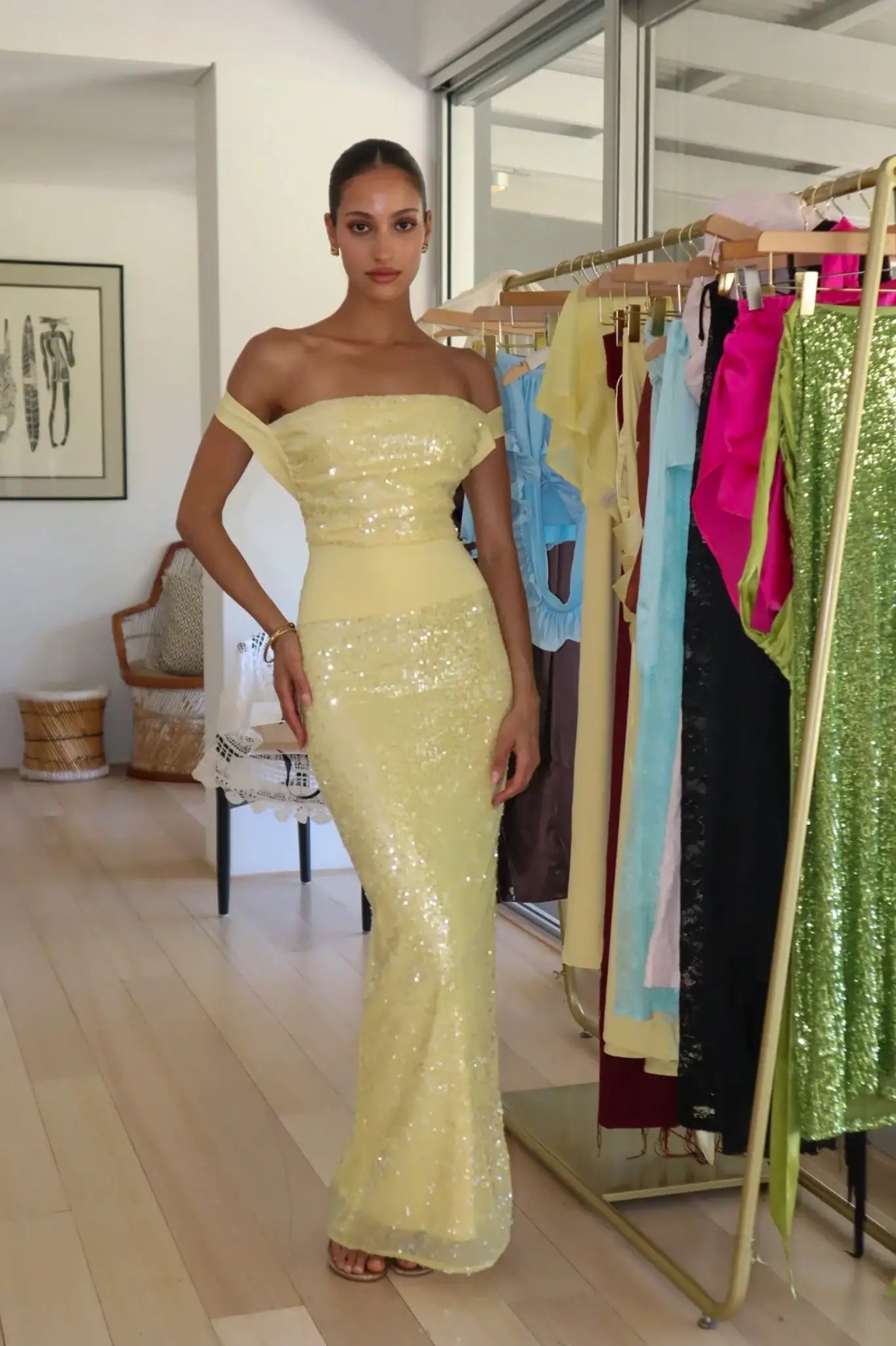 Deconduarte Lilou Dress Hire in Baby Yellow. Image of straps set in their off-the-shoulder style. Sydney Dress Hire with a Speedy Delivery & Simple Returns Service. Book now!