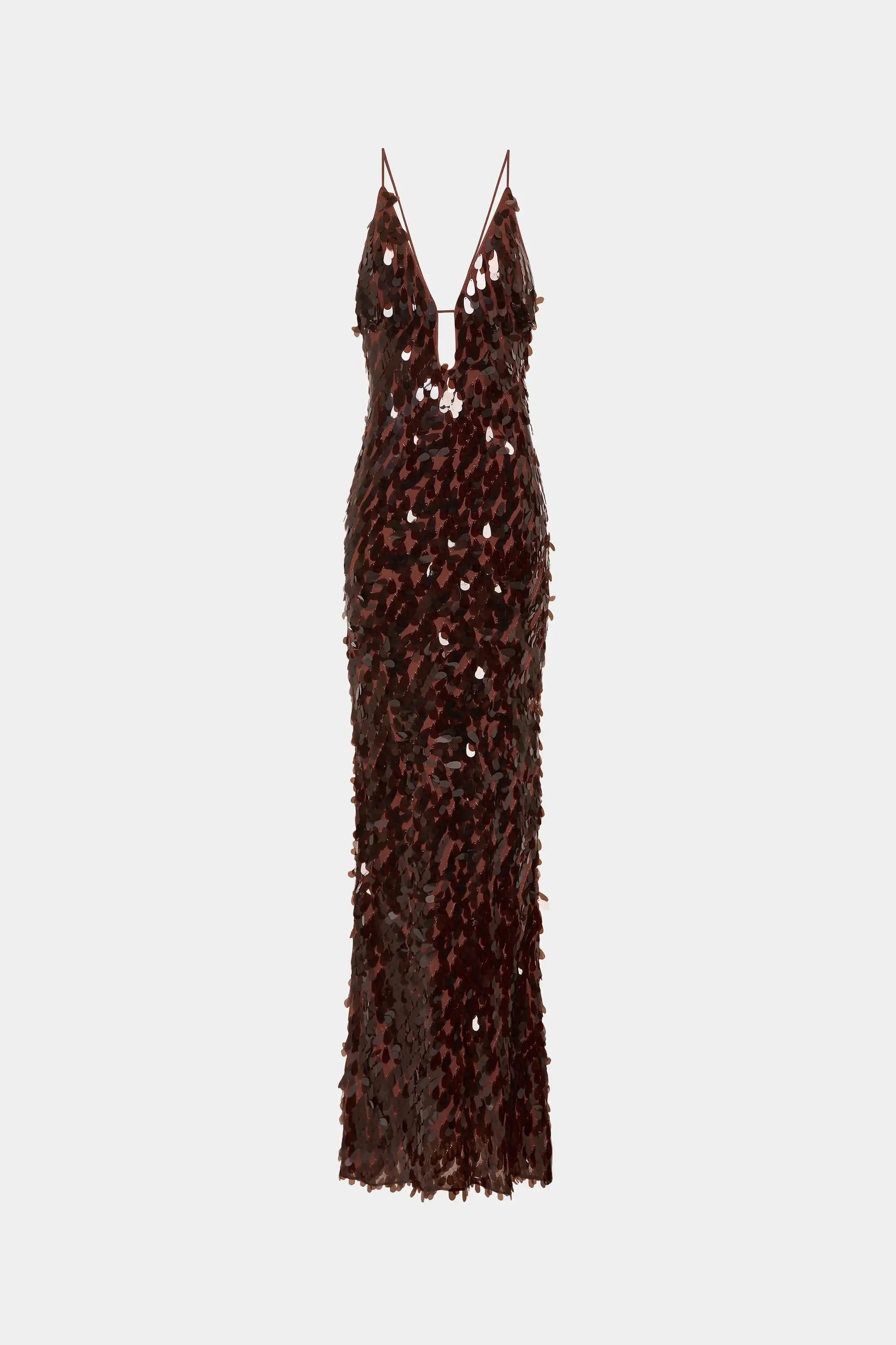 Flat-lay image of the Misha Sapphire Sequin Maxi Dress in Fig. A deep, mauve toned, high-clarity dress - The multi-dimensional sequin embellishment allows for dramatic reflection and a unique, radiant finish. Book now!