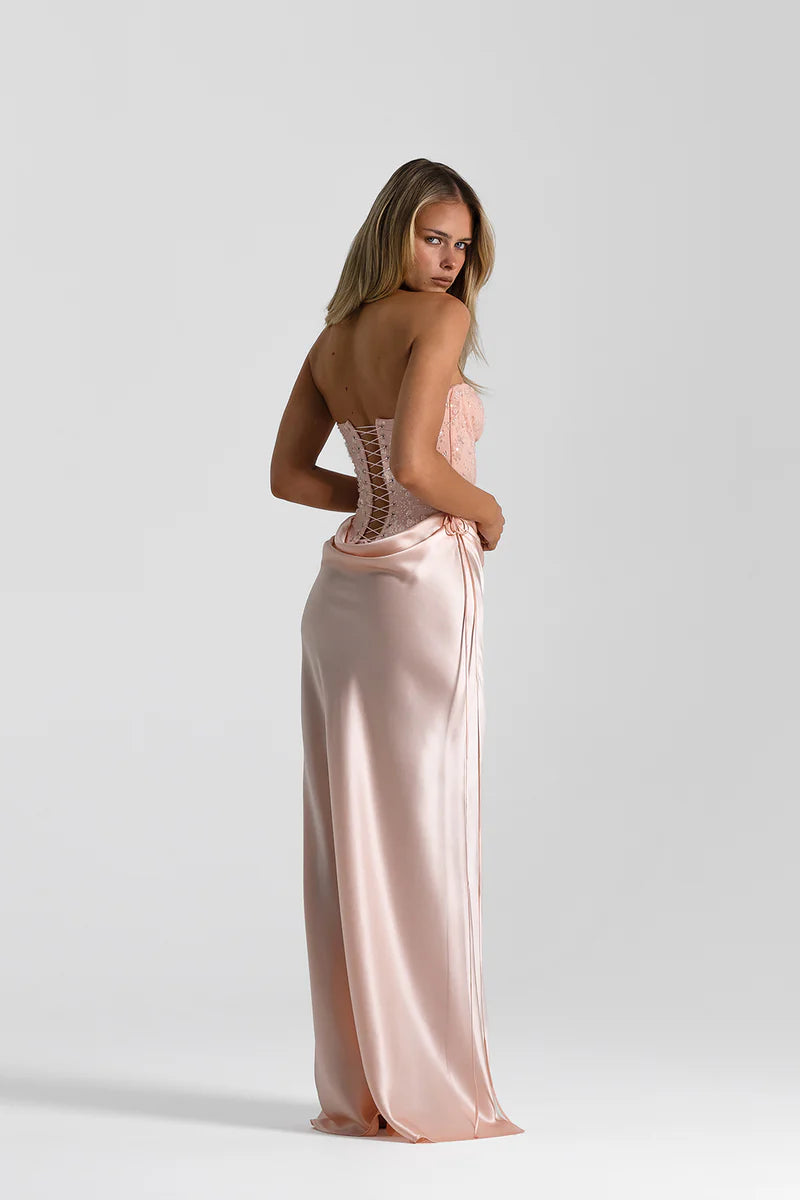 Back, side view of Natalie Rolt Verity Bustier and Evelyn Skirt Full Set Hire in Blossom (Baby Pink).